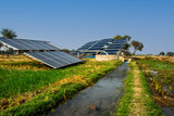 Fototapeta Góry - solar panels and tube well for irrigation on a farm