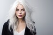Lady With Striking White Hair And Extraordinary Appearance On The Background Of White Wall
