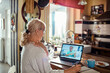 © Marko Geber - Mature senior woman talking to doctor on video call from home