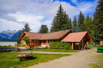 Log house of the Historic Taku Glacier Lodge, a wooden cabin located on the shores of a melt water lake in the mountains north of the Alaskan capital city Juneau