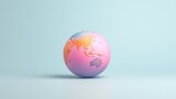 Fototapeta Pokój dzieciecy -  a pink and blue egg with a map of the world painted on it's side on a light blue background.