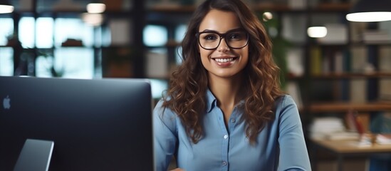 portrait of successful businesswoman in modern office looking at camera