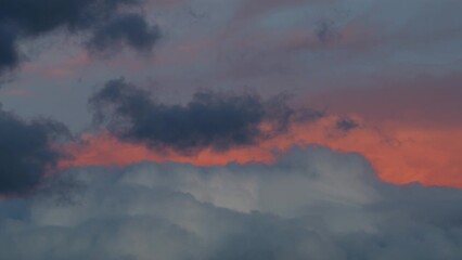 Wall Mural - Orange sky up to the grey clouds