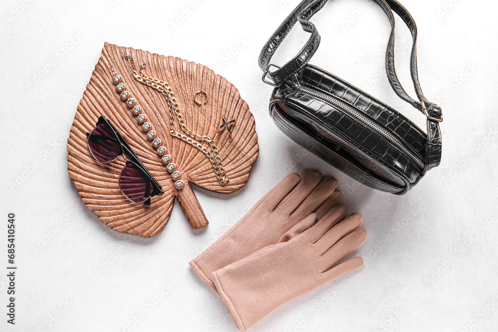 Composition with stylish female accessories on light background