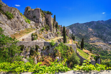 Summer landscape - view of the ruins of the Klis Fortress, near Split on the Adriatic coast of Croatia