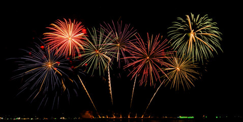 Fireworks show under defocus or blur concepts with isolated black background at night, this celebration is for the International Fireworks Festival in Pattaya on Nov 24-25 in Thailand.