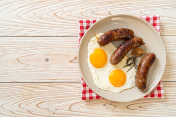 Wall Mural - double fried egg with pork sausage