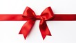 © Kartika - Image of red ribbon with bow isolated over white background. Holiday season decoration