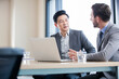 © Blue Jean Images - Business people talking in meeting room