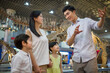 © Blue Jean Images - Young family in museum of natural history