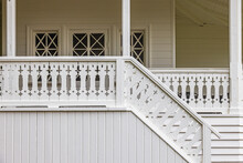 Porch With Woodwork Decorations On The Railings And The Stair