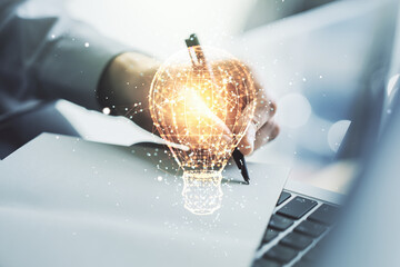 Aufkleber - Double exposure of creative light bulb hologram with hand writing in diary on background with laptop, research and development concept