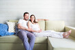 © Dasha Petrenko - Pregnant woman and young man together indoors