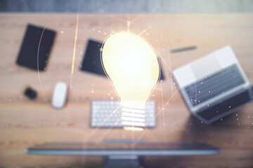 Poster - Creative idea concept with light bulb illustration on modern laptop background. Multiexposure