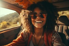 Beautiful smiling girl dressed in hippie style in front of a retro van. Happy Hispanic female tourist traveling through a picturesque tropical country. Travel concept.