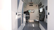© Ruslan - Panoramic view of an organized, clean ambulance interior with medical equipment ready for emergencies. Interior of a service medical vehicle.