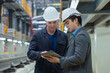 © Washburn - Bosses and business owners inspect the condition of electric trains at the tracks in the maintenance shop.