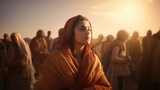 Fototapeta  - Beautiful girl in the orange shawl on the background of the desert.  Biblical character