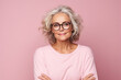 © koala studio - Portrait of a beautiful businesswoman in eyeglasses over pink background