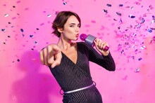 Photo Of Charming Confident Girl Dressed Glamour Clothes Signing Karaoke Showing Finger You Isolated Pink Color Background