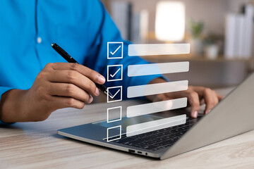 Canvas Print - Business performance monitoring and evaluation concept, Take an assessment, Business man using laptop and tablet online checklist survey, Filling out digital checklist, Questionnaire with checkboxes.