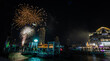 Colorful fireworks light up a riverside hotel, firework display in the heart of Bangkok on Loy Krathong Day in the middle of the Chao Phraya River, Bangkok, Thailand on November 27, 2023.