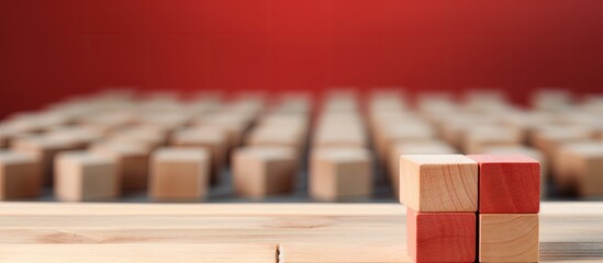 Poster - Closeup of a unique red wooden cube among blocks Copy space image Place for adding text or design