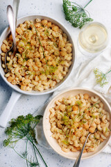 Wall Mural - Scallop with creamy pasta in a white frying pan.top view