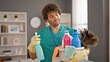 © Krakenimages.com - Young hispanic man professional cleaner holding clean products at home
