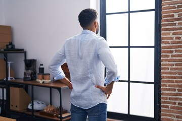 Poster - Young arab man business worker looking throw the window at office