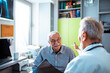 © Davor - Happy senior man receiving good news from doctor at hospital