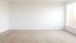© JVLMediaUHD - A photograph of a white room with empty space, not filled with furniture, is framed by natural ligh
