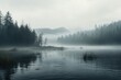 A serene and misty day by the water, with trees surrounding the tranquil scene. 