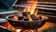 barbecue grill pit with glowing and flaming hot charcoal briquettes close up