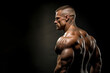 © MM - Muscular bodybuilder on a black background. Relief and muscles