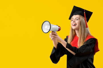 Canvas Print - Female graduate student shouting into megaphone on yellow background