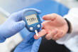 © Proxima Studio - Doctor using glucometer, blood glucose test