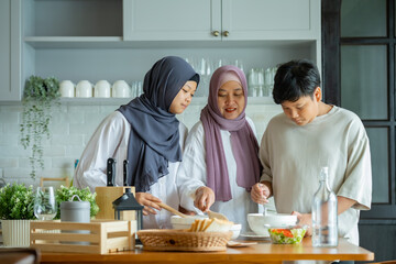 Sticker - Cute Girl and Son and Her Muslim Mom In Hijab Preparing Pastry For Cookies In Kitchen, Baking Together At Home. Islamic Lady With Daughter and son Enjoying Doing Homemade Pastry