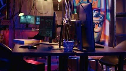Poster - close up shot of software interface on computer screens showing developer code running in empty crim