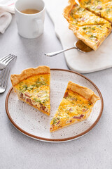 Wall Mural - Homemade quiche with ham and cheese cut on the table