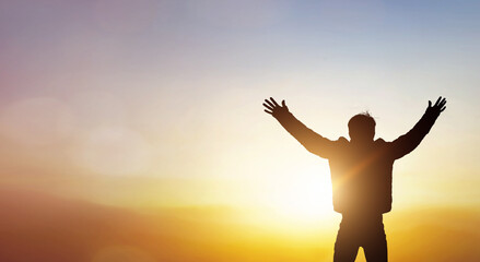Wall Mural - human hands open palm up worship on sunset background.