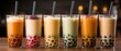 © Sawitree88 - A row of brand-new bubble tea glasses with boba on a wooden backdrop..