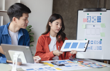 Business teamwork and working with UX developer and UI designer at table in modern office. Creative and development agency concept.