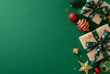 Wall Mural - Christmas magic captured: Overhead shot of DIY paper gift boxes, opulent ornaments, sparkling star decor, jingle bell, and confetti on a festive green backdrop