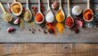 Top view on mixed dry colorful spices in wooden spoons on rustic table