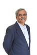 Smiling Senior Indian businessman or executive in a light blue shirt and dark blue suit