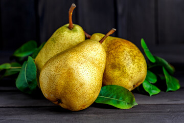 Wall Mural - Ripe pears.Freshly harvested pears on old wooden background.Vegetarian, vegan, healthy diet food.