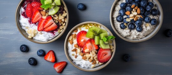 Poster - Top view of a summer recipe: strawberry, nut, and blueberry topped cottage cheese in a gray breakfast bowl.