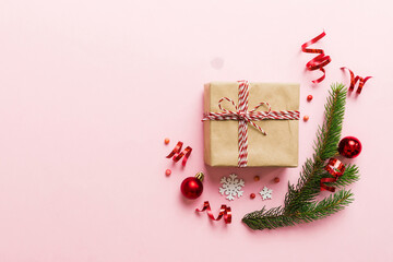 Wall Mural - Top view Flat lay Christmas decorations and gift box on colored background with copy space. Christmas or Happy New Year composition