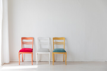 Poster - Three colorful vintage chairs in white room interior